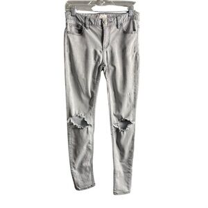 Free People light gray size 26 women busted knee skinny leg jeans.
